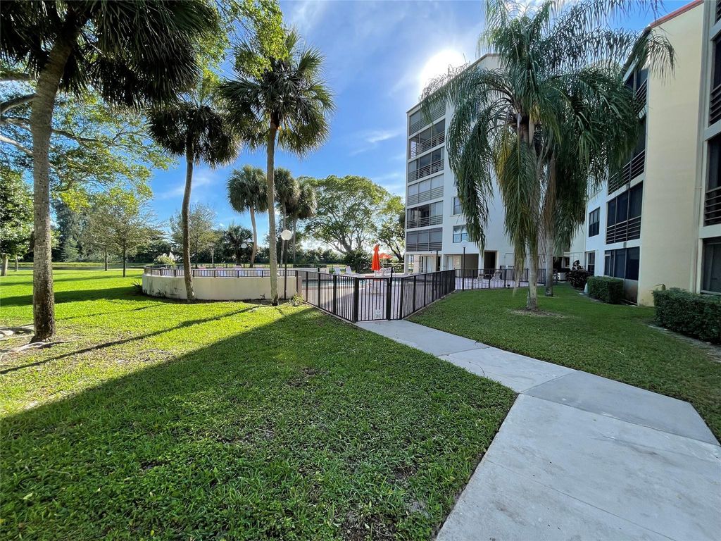 Photo of 2312 S Cypress Bend Drive #106, Pompano Beach, FL 33069 (MLS # F10411931)