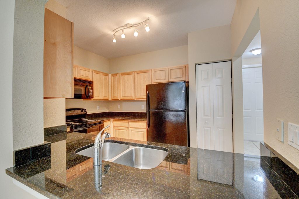 Photo of 101 Harrington Court, Palm Springs, FL 33461 (MLS # B26027470)