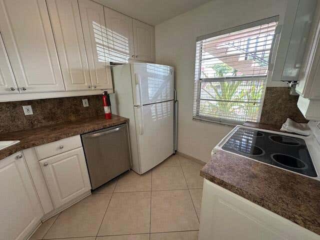 Photo of 21 Abbey Lane #107, Delray Beach, FL 33446 (MLS # B26036245)