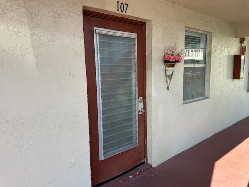 Photo of 21 Abbey Lane #107, Delray Beach, FL 33446 (MLS # B26036245)