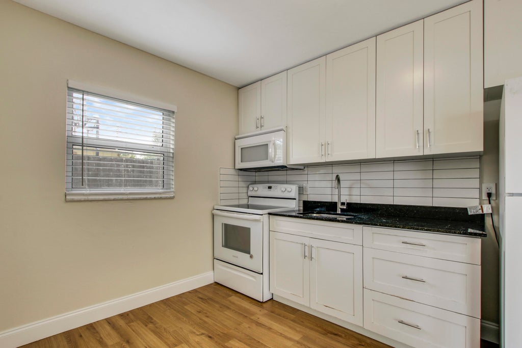 Photo of 593 PALMETTO Drive #1, West Palm Beach, FL 33403 (MLS # B26080512)