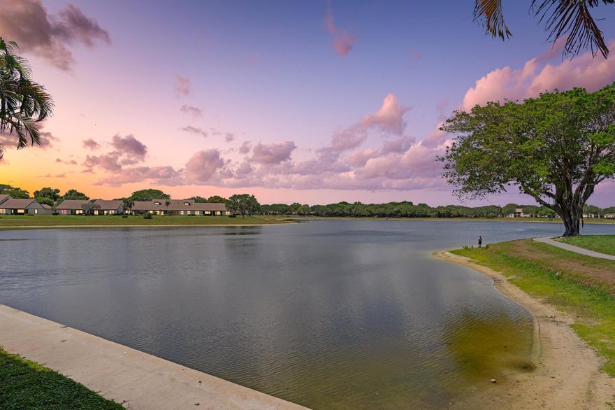 BEST WATER'S EDGE VIEW | 1ST FLOOR CONDO |  PRESTIGIOUS GATED COMMUNITY OF LAKE WINDWOOD | BREATHTAKING WATER VIEWS | BIKE/JOG TO BEACH | 20-ACRE SPRING FED LAKE | 5-ACRE WILDLIFE PRESERVE | OPEN GREEN SPACE | Bright Open Floor Plan | Tile Floors | Beautiful Eat-in Kitchen | Wood Cabinets | Large Primary Bedroom with Walk-In Closet & Oversized En-Suite | Screened Patio | Assigned & Guest Parking | Resort-Style Amenities | 24-Hour Manned Gate | 2 Clubhouse Pools | Dog Park | BBQ Picnic Area | Jog/Bike Trail | Tennis/Basketball/Racquetball | 1.5 Miles to Beach | Minutes to FAU, Mizner Park, Atlantic Ave,1-95 | A+ Rated Schools | Rent Immediately | Pet Friendly | AC 2014 | WH 2023 | Present All Offers!
