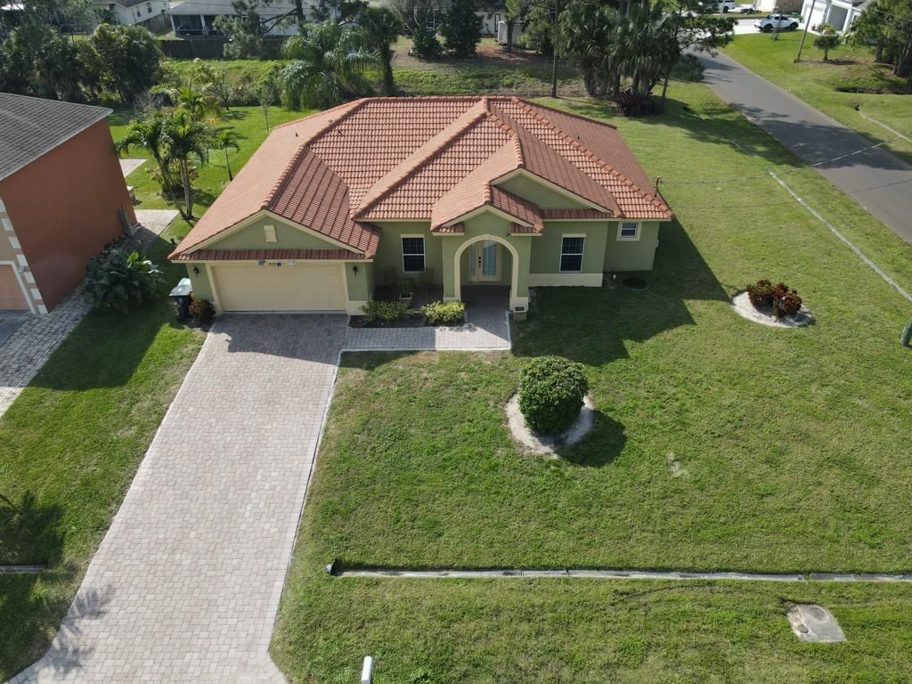 Photo of 4102 SW Utterback Street, Port Saint Lucie, FL 34953 (MLS # R10955131)