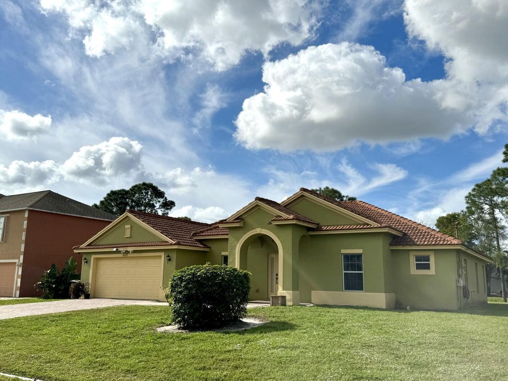 Photo of 4102 SW Utterback Street, Port Saint Lucie, FL 34953 (MLS # R10955131)