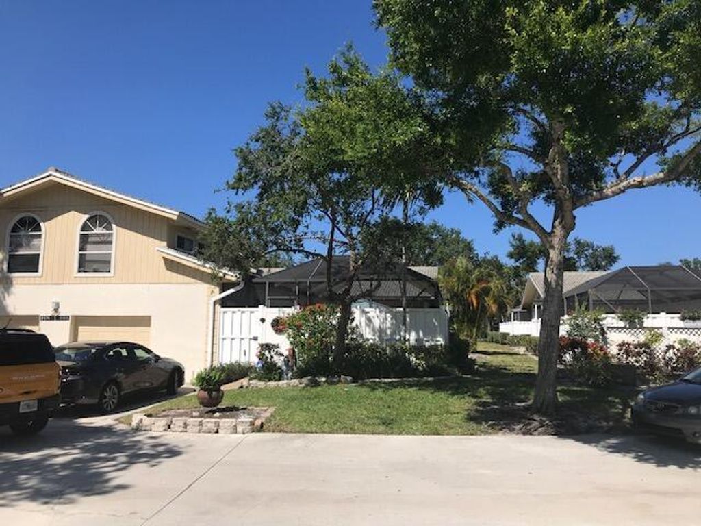 Photo of 5186 Woodruff Lane, Palm Beach Gardens, FL 33418 (MLS # R10720280)