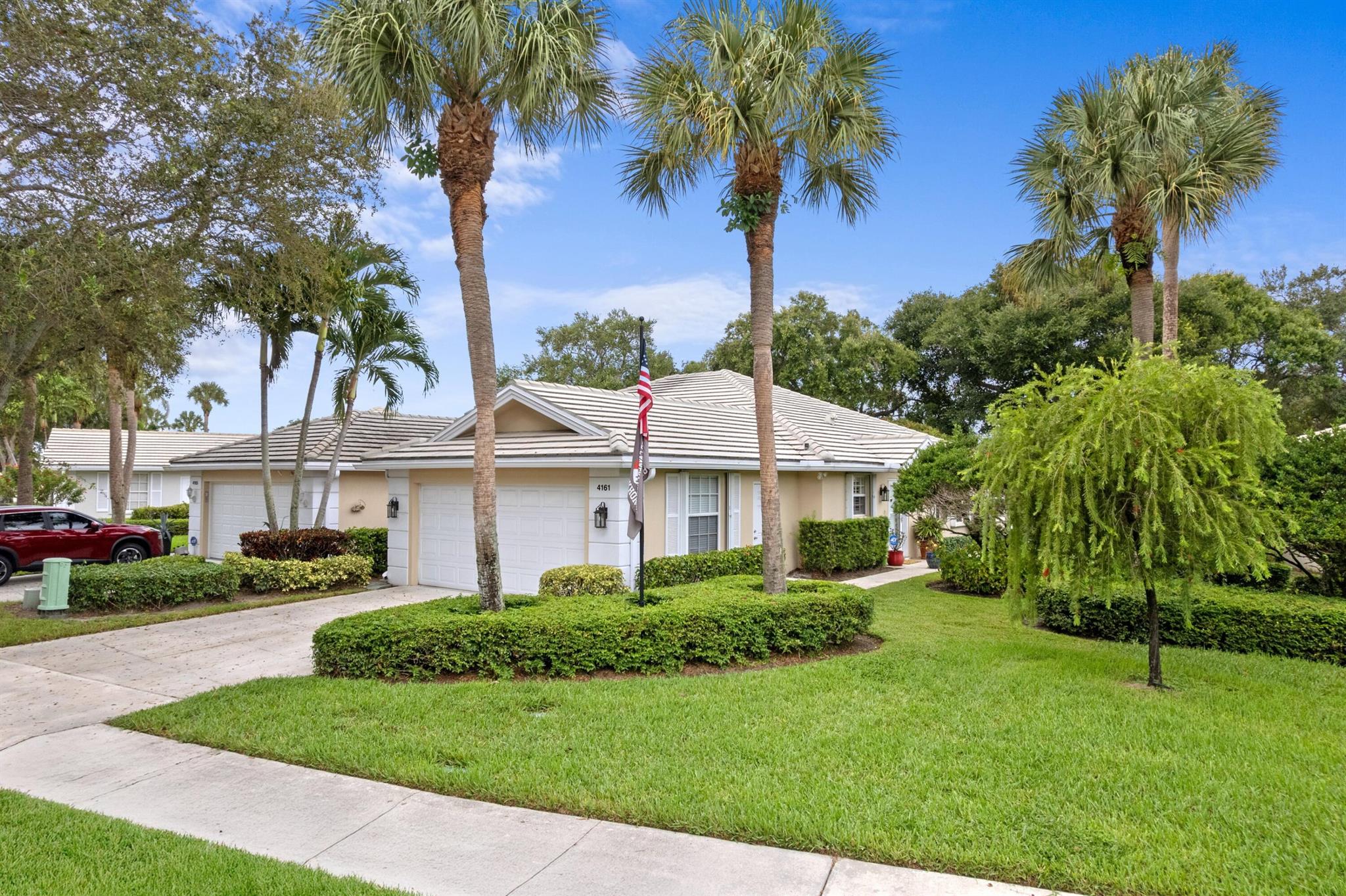 Rare end unit villa directly on the lake, with long lake views. Completely updated kitchen and both bathrooms, including ''Granite'', Jacuzzi tub, and separate amazing shower. Full accordion shutters. Ceramic tile floors throughout (No carpet). Tall cathedral ceilings. Both bedrooms are master suites. Full-house generator included, so you never lose power. Beautiful 24-hour guard gated DiVosta community with onsite manager, pool, clubhouse, pickleball, tennis. HOA includes front lawn and cable.