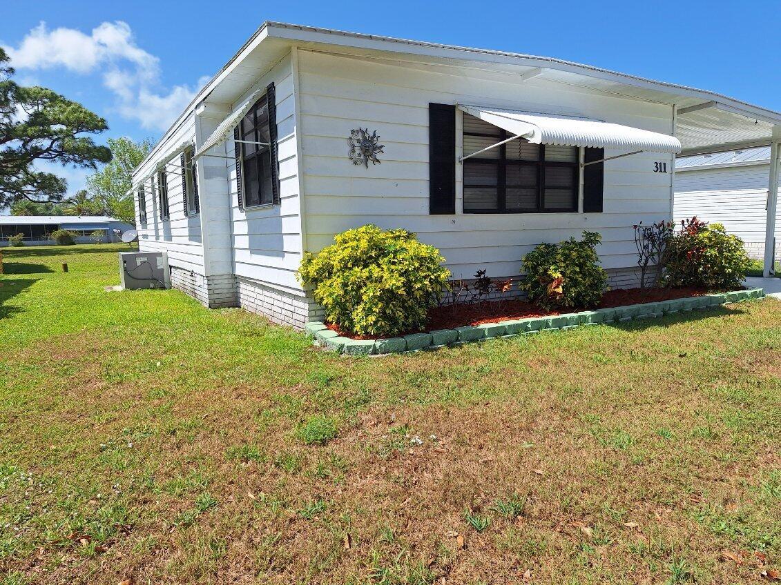 This cute 2 bedroom 2 bath home has been renovated, the water heater 2024, roof 2020, AC 2018,.it has a Fla. room that is air conditioned, freshly painted inside, walk in shower in the master bedroom, vinyl plank flooring in the living room and hallway, new appliances, furnished, hurricane shutters, with a private back yard, sit outside and enjoy the gentle breeze, close to restaurants, shopping & beach access. golf privileges, walking distance to the community pool and clubhouse, rooms sizes are approx.