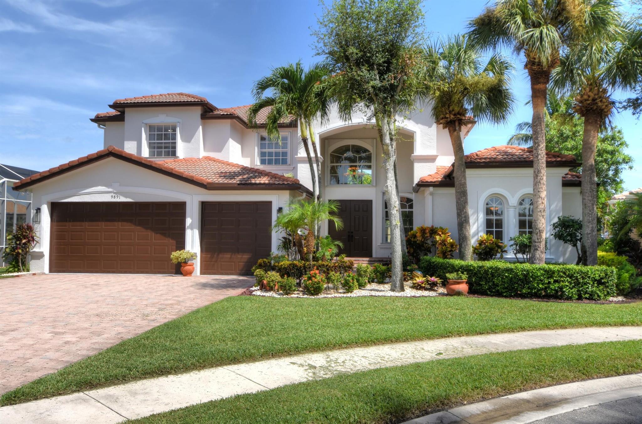 Welcome to this spacious and beautifully designed 5 bedroom, 4 bathroom Mediterranean style home. Located in the sought-after community of Isola Bella Estates. This home is situated on one of the biggest culdesac, waterfront lots in the community. Offering over 3,800 SF of living space across two stories, this home features high ceilings and a functional layout with the primary suite and extra bedroom downstairs. Additionally the upstairs features a nice size loft and 3 extra bedrooms. The beautiful kitchen has all new stainless steel appliances. Lake views can be seen throughout the home. With a great central location in Lake Worth, residents have easy access to Florida's turnpike, top rated schools, shopping, and dining.