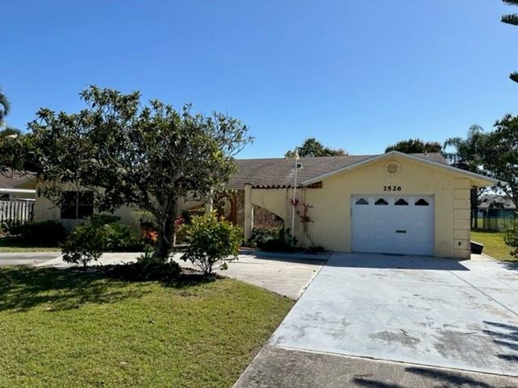 Photo of 2526 SE Grand Drive, Port Saint Lucie, FL 34952 (MLS # F10408035)