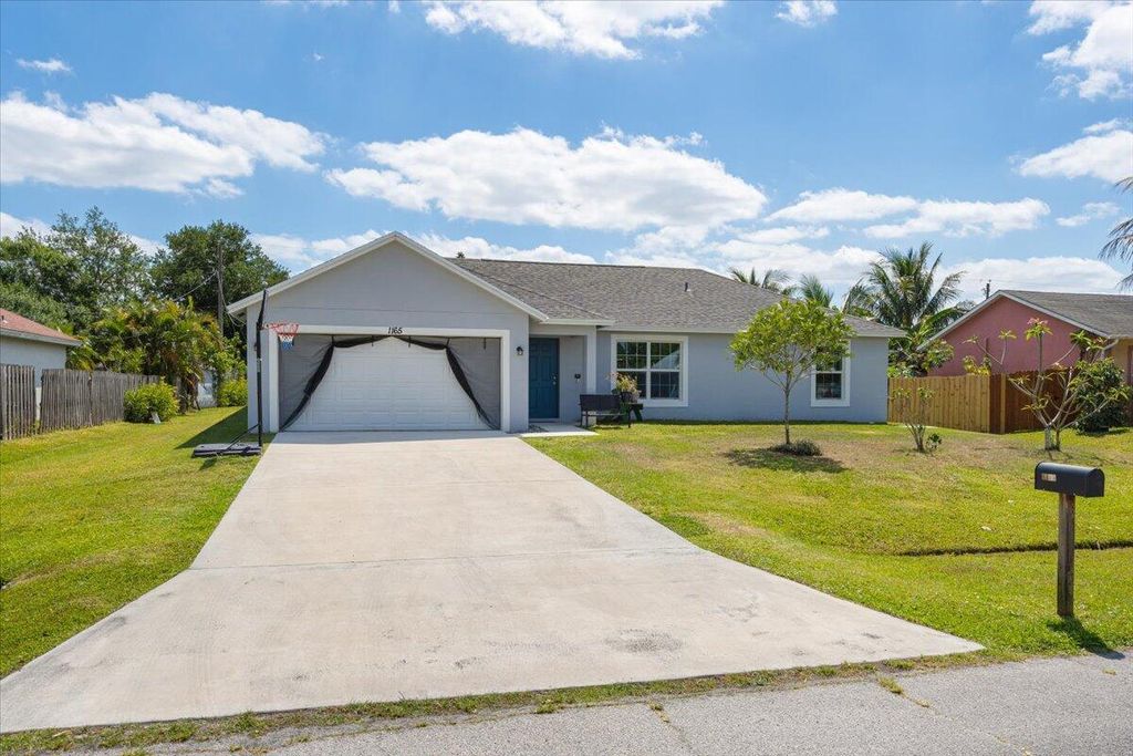 Photo of 1165 SW Empire Street, Port Saint Lucie, FL 34983 (MLS # R11083388)