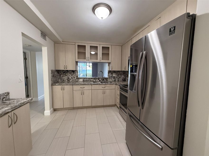 Move-in ready, freshly updated condo has 1-bedroom with walk-in closet, 2 bathrooms, has convertible room that could be used as a guest area, office, or use it to meet your specific needs. Both bathrooms have showers with waterfall tile design. Quartz countertops - bathrooms and kitchen. Stylish kitchen with neutral color cabinetry, stainless steel appliances, & stackable washer/dryer.  All floors have continuous tile design. Dining & Living room combined - looks out to the screened patio. Colony Point is a Housing for Older Persons Act community with a guard gated entrance. Amenities include clubhouse, exercise room, pool, courtesy bus service,  in-house property manager,  unit - 1 assigned parking spot. Nearby Shopping, Restaurants and a Hospital. *As-Is with Right to Inspect.
