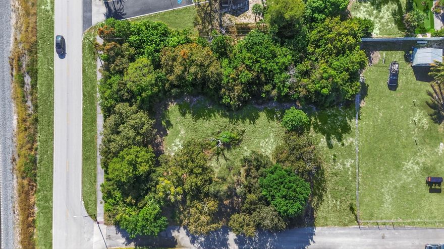 Discover the potential of this rare, 30,952 sq. ft. corner lot,  in desirable Hobe Sound. With multifamily zoning and the option to subdivide, you can build your dream custom home and still create an additional residence for investment or extended family. Approved for single-family, townhouse, duplex, or modular construction.