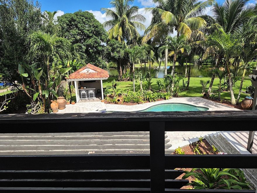 Nestled in the prestigious Davie Area, this exquisite 4-bedroom, 5-bathroom estate  Fully remodeled in 2002 & meticulously maintained, this **3,923 sq ft. Step inside to an open-concept layout flooded with natural light, featuring gleaming tile flooring throughout, fireplace in the family room, .The **gourmet kitchen** , stainless steel appliances, granite countertops. The **primary suite** a spa-like en-suite bathroom, a soaking tub, and direct access to the balcony overlooking the lake. Upstairs, 3 comfortable bed 2 full baths  Maids room perfect for live-in help spacious playroom or private office with a separate entrance endless potential for a home business, gym or studio private pool and spa. No HOA    4 car garage for your Cars perfect mancave