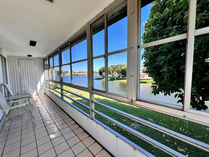 WOW --- AMAZING LOCATION WITH WATER VIEWS IN 55+ CENTURY VILLAGE! Desirable Somerset Section CORNER 2/2! Bright & Beautifully Maintained With Large Rooms. The Long Lanai Is The Perfect Spot To Take in the Water Views! Nicely Maintained Building With Lift & Second Floor Laundry. Sold AS IS & Furnished (two hurricane lamps & display case in living room are excluded) Fantastic Location Close to the Main Clubhouse, Haverhill Gate, and the Popular Somerset Pool & Tennis Courts!  Century Village is a Resort Style 55+ community with so... so much to offer - shows, movies, clubs, pools, security, and transportation service. The Clubhouse features a theater, indoor pool, card room, community/party room, billiard room, shuffleboard, tennis, pickleball, bocce, and two outdoor pools. Numerous heated outdoor pools throughout the community. Separate fitness center with gym and outdoor heated pool & resistance pool. Two guarded gates and 24-hour roving security patrol.