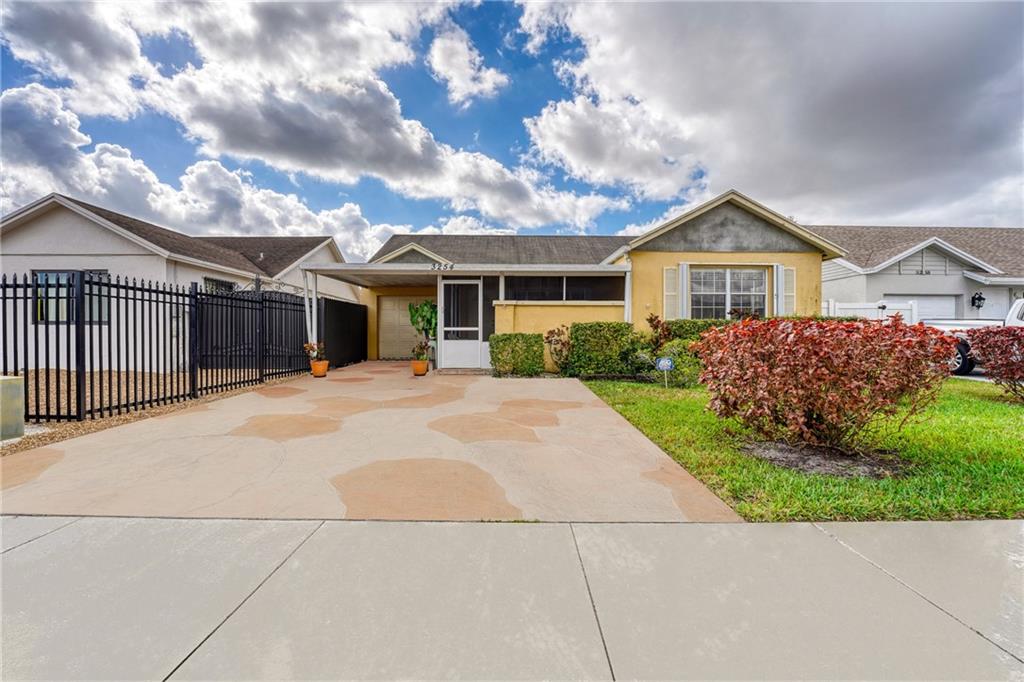 Spacious 1 car garage home in an excellent Miami Gardens location! This 3 bedroom, 2 bathroom home is a perfect opportunity for you to design your dream house, or own an investment with NO RENTAL RESTRICTIONS. Practical kitchen with stone countertops and backsplash, stainless steel appliances, and tons of natural light. Partially updated bathrooms with neutral tones and modern finishes. Enjoy your afternoons relaxing on this spacious covered patio. Fenced yard, accordion shutters, 5-6 year-old AC, and 9-10 year-old roof. EXCELLENT LOCATION! 5 minutes from the Hard Rock Stadium, minutes from main highways, parks, dining, shopping, and entertainment. Less than 30 both Miami and Fort Lauderdale airports and only 30 mins from the beach.