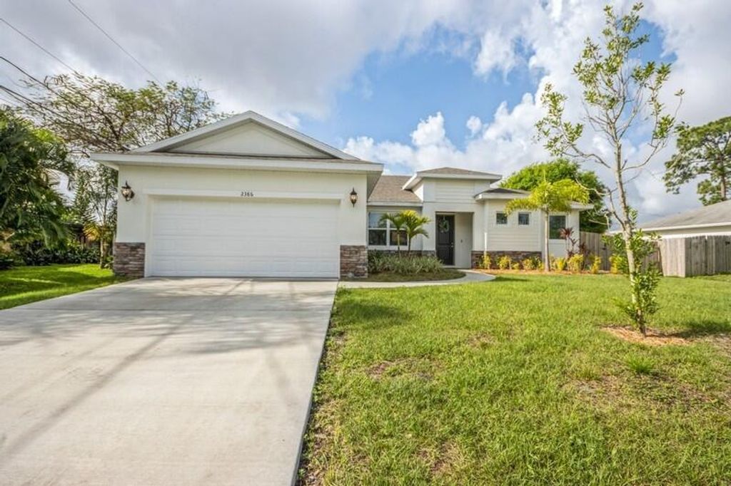 Photo of 2386 SW Madrid Road, Port Saint Lucie, FL 34953 (MLS # R10694762)