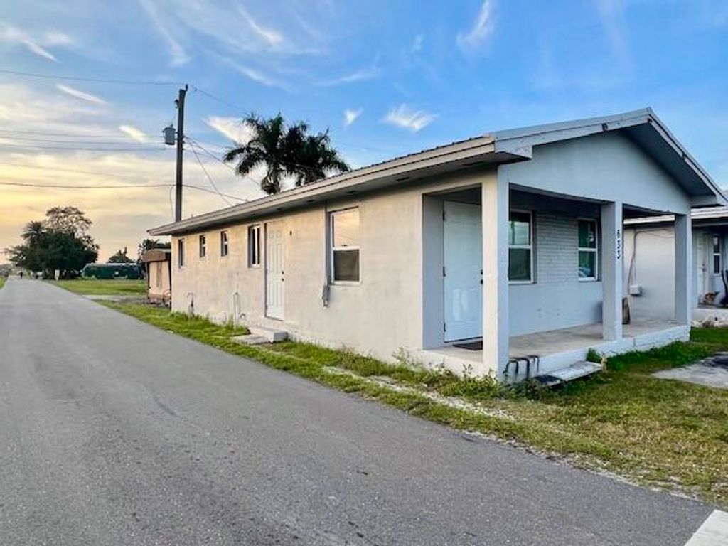 Photo of 633 Amaryllis Avenue, Pahokee, FL 33476 (MLS # R10969370)