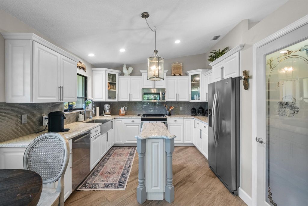 Photo of 2077 SW Heronwood Road, Palm City, FL 34990 (MLS # R10962024)