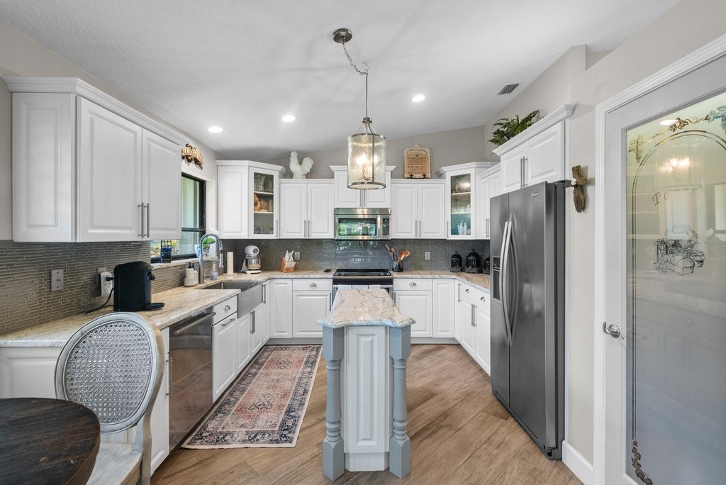 Photo of 2077 SW Heronwood Road, Palm City, FL 34990 (MLS # R10962024)