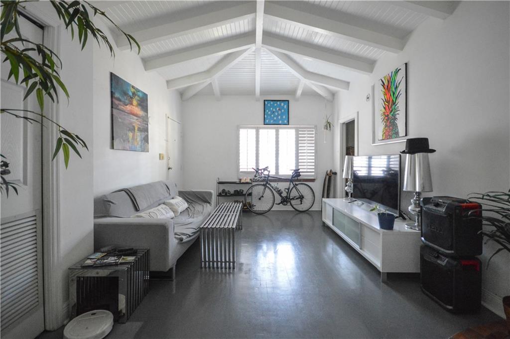 Quintessential Miami Beach living! If LOCATION, LOCATION, LOCATION is what you're after, then look no further. Just one block from the Lincoln Rd. Shopping & Entertainment District, 0.5 miles from the Filmore Theater, 4 blocks to Collins Ave, Ocean Drive & Lummus Park, 3 blocks to Flamingo Park. Who needs a car when you can walk to everything. Built in 1934, this Art Deco condo is located in the heart of the Miami Beach Art Deco Historic District. There are 2 bedrooms, 2 updated bathrooms, open kitchen with breakfast counter and dining area, living room with vaulted ceilings and exposed beams. With windows on three sides of the condo, abundant natural light makes the space bright and airy.