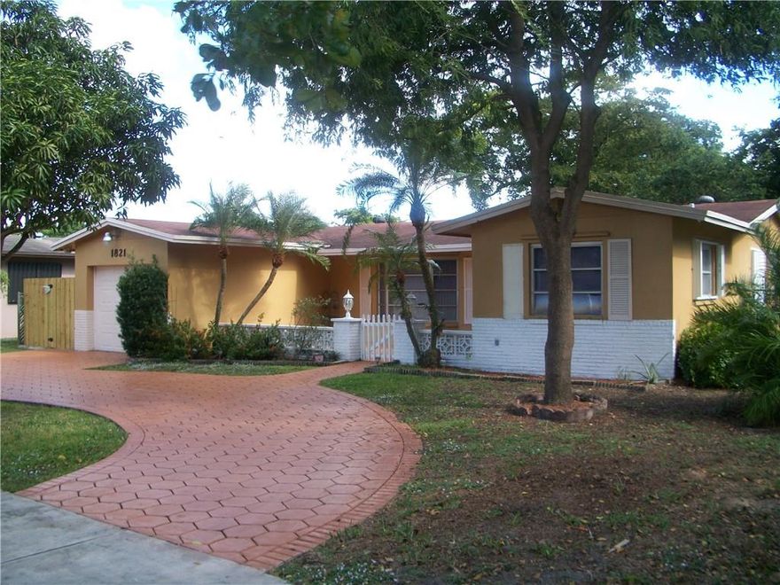 A must see.....A spacious 3/2 single family home in a quiet residential neighborhood. It has an updated kitchen, formal living room, family room, all bedrooms with wood floors and walk-in closets, security camera system, hurricane shutters, separate laundry room with W/D, screened patio, shed, fenced backyard with palm and fruit trees. There is an garage/efficiency that is not included with the rental.