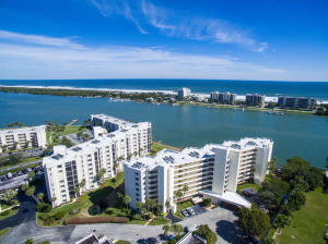 Breath taking views of the intracoastal and ocean from every main room of this spacious, 6th floor unit. Split plan floor plan with dual masters. Unit features engineered hardwood floors, crown molding, newer light fixtures and ceiling fans, walk-in closet, spacious covered balcony, new A/C unit in 2015, accordian shutters, newer carpet, storage locker and many upgrades. A day dock is available for boaters returning from a day of fishing or a trip to the ''Sand Bar''. The resort style community offers a geo-thermal heated pool, recently remodeled clubhouse with full kitchen, billiards table, tennis court, sauna, carwash, kayak rack, bike storage and more. Buyer to verify all information and measurements.