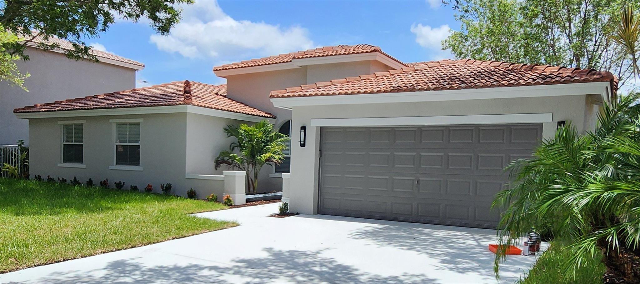 Welcome to your dream home in Coquina Lakes! This upgraded 4/ 3 with a 2-car gar is located in a gated community. Offering 2400 sq ft of incredible living space, this home features a great floor plan designed for modern living. Beautiful lake views from your master bedroom, living room, and kitchen. The completely upgraded kitchen with a huge island, beautiful quartz countertops, a full backsplash, and brand-new Samsung black stainless steel appliances. The bathrooms have been nicely redone, and new luxury vinyl flooring throughout. Step outside to enjoy the extended back porch and soak in the tranquil lakefront setting. Situated across the street from the Promenade Mall, you'll have easy access to excellent restaurants and shops, and you're just minutes from top-rated schools.