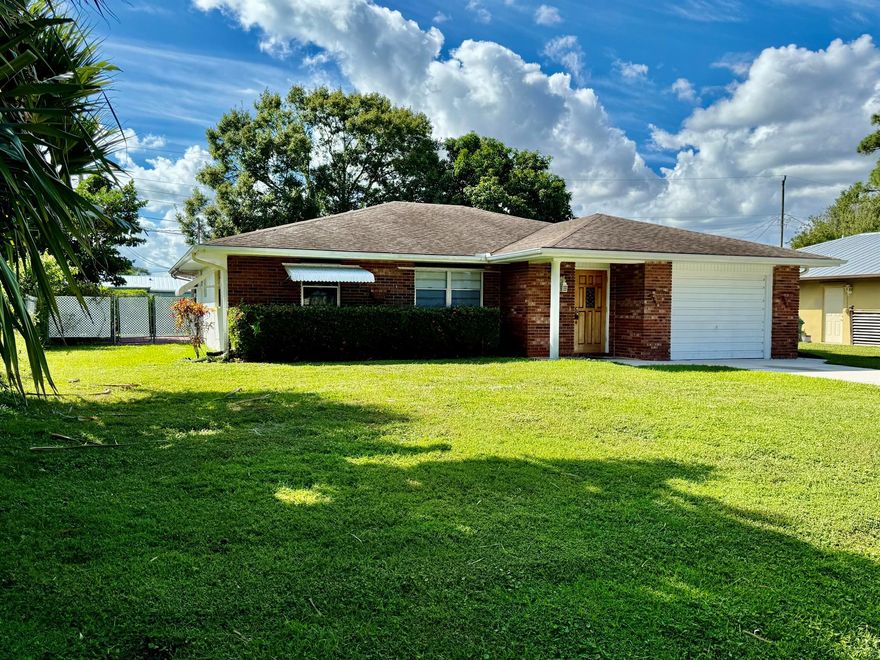Charming CBS with Brick 2 bedroom, 2 bath home with great potential. Discover the opportunity to make this home your own! Featuring a spacious layout with a pass-through from the kitchen to the den or dining area, this property offers both comfort and flexibility. Enjoy relaxing or entertaining on the screened-in back patio, perfect for Florida living. The home includes a one car garage and a functional floor plan that's ready for your personal touch. Priced right for upgrades needed-choose you own finishes and create your dream space!