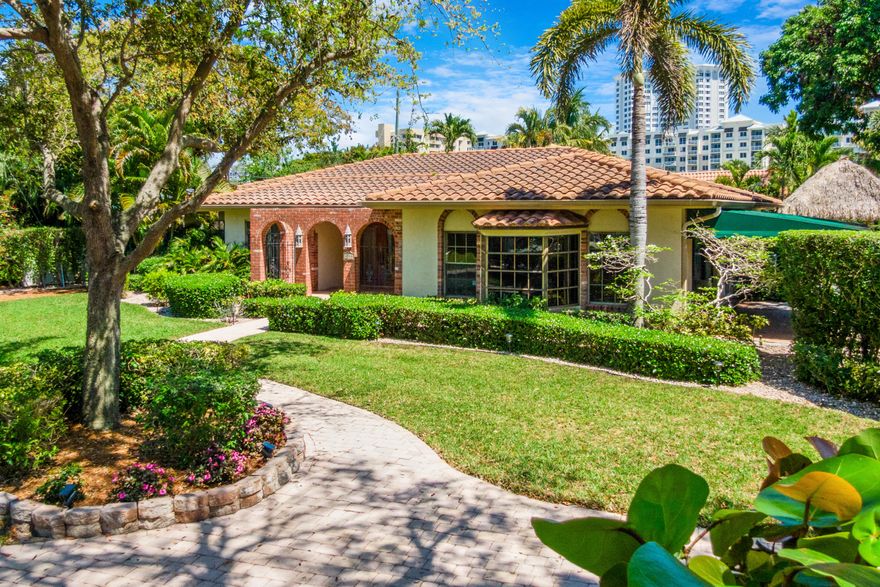 Located just steps from the ocean in the highly sought-after Terra Mar neighborhood, this beautifully appointed 3-bedroom, 3-bathroom home with office and family room offers the ultimate barrier island lifestyle. Situated on a large corner lot with lush, mature landscaping, the property features nearly 3,000 square feet under air and multiple indoor and outdoor living spaces designed for both relaxation and entertaining. Inside, a spacious and inviting layout unfolds with a generous kitchen and dining area that serves as the heart of the home, ideal for hosting gatherings. The thoughtful floor plan includes a dedicated office and separate family room, providing flexibility for work, guests, or additional living space. Outdoor living is a standout feature, with a modern saltwater pool  complete with a water feature and travertine pool deck, creating a private resort-style setting. A fully equipped tiki hut with electricity  including lighting, fan, and TV, enhances the backyard experience, while a front courtyard and multiple seating areas offer additional spaces to unwind. Enjoy the convenience of a true coastal lifestyle, Terra Mar Island is a gated waterfront community of approximately 140 single-family homes, located right off A1A. The surrounding area features sidewalks throughout, making it easy to walk or bike to the beach or into Lauderdale-by-the-Sea for restaurants, shops, and nightlife. With only one way in and out, traffic stays light and the community maintains a quiet, residential feel. For boating enthusiasts, multiple nearby public boat ramps and marinas provide convenient access.  The location is also highly accessible for commuters: approximately 20 minutes to FTL Airport, 40 minutes to MIA, and 1 hour to PBI Airport. Terra Mar is a great option for buyers looking for a laid-back coastal lifestyle with beach access, walkability, and a true neighborhood feel. This is a rare opportunity to own a spacious home in one of the area's most desirable ocean-close communities.