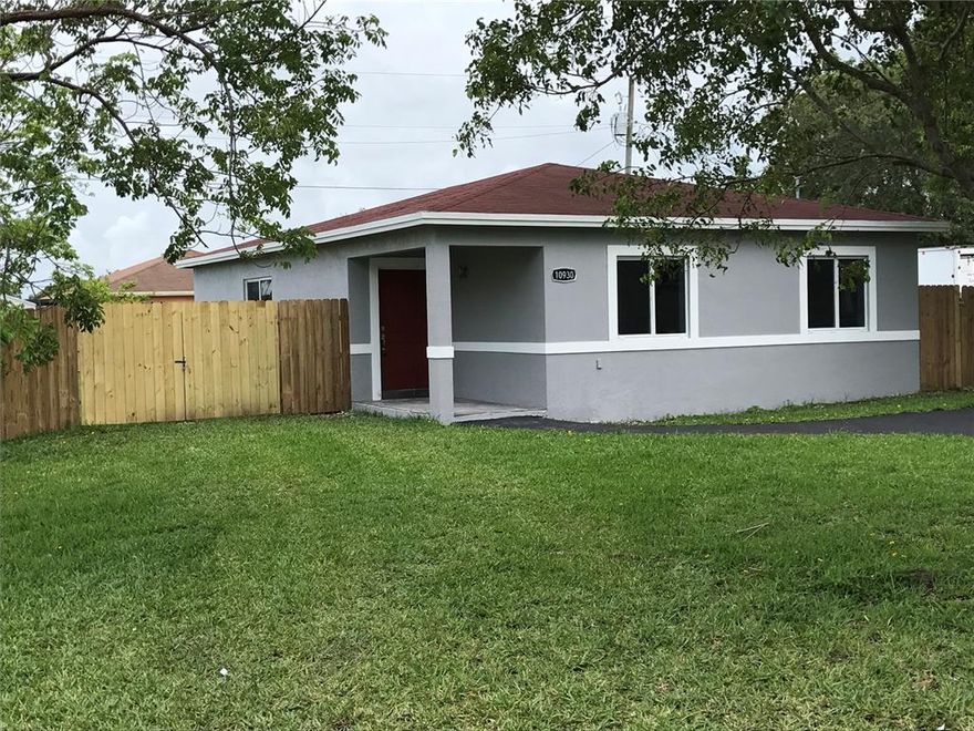 Recently remodeled 3/2 single family home.  This home comes with brand new high efficiency Carrier central air/heat, new hurricane impact doors and windows, new tankless water heater and new kitchen and bathrooms with Quartz countertops, new stainless steel appliances including washer and dryer and a huge fence in yard.  It is move in ready!  The home will have the A/C outside unit and appliances installed before final walk through.