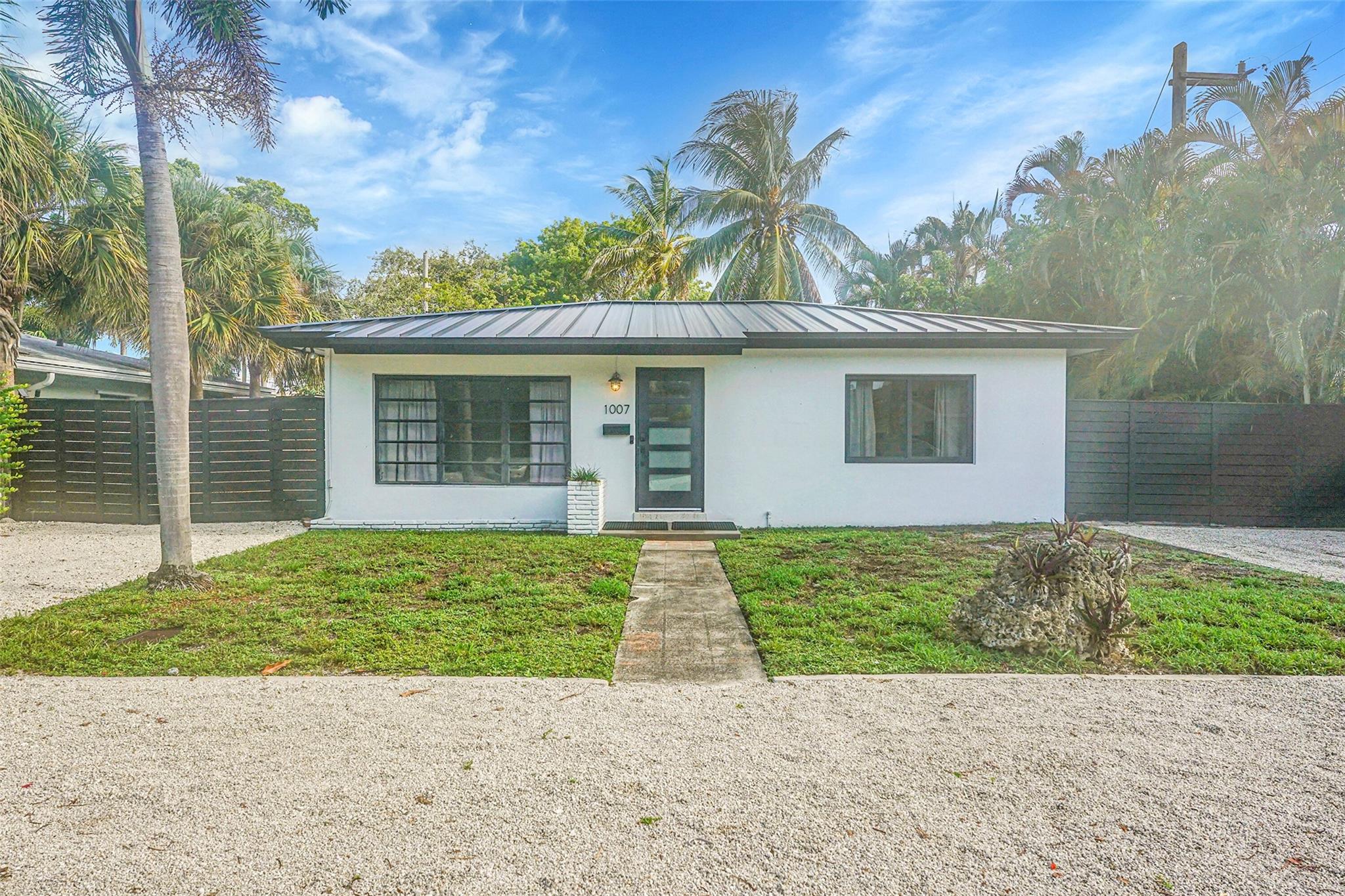 Mid-century single-family home with 2 bedrooms PLUS Florida Room/ Den (with AC) in EAST Ft. Lauderdale—no HOA! Lake Ridge is just 2 miles from the Beach & 3 miles to I-95. PETS welcome & low deposit ($1,500). Large driveway + HUGE fully-fenced backyard for privacy. Minutes to Downtown, schools & trendy 13th Street dining/ nightlife / fitness district. The home features in-unit washer/dryer, central AC, terrazzo floors (no carpet), stainless range, dishwasher, microwave; renovated bathroom & open floor plan. Lawn maintenance & pest control are included in the rent. Move-in ready—available now! close to Holiday Park: Baptist FL Panther's IcePlex, pickleball courts, rec sports, dogs parks & fitness centers.