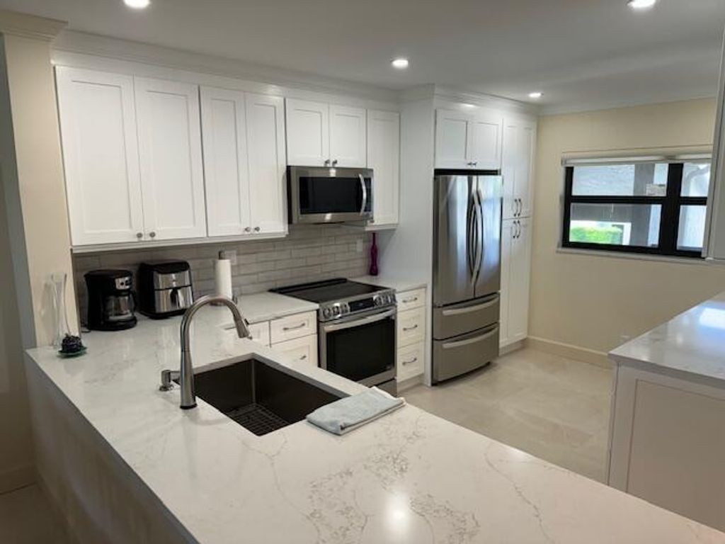 Photo of 13403 Touchstone Place #203, Palm Beach Gardens, FL 33418 (MLS # R11001061)