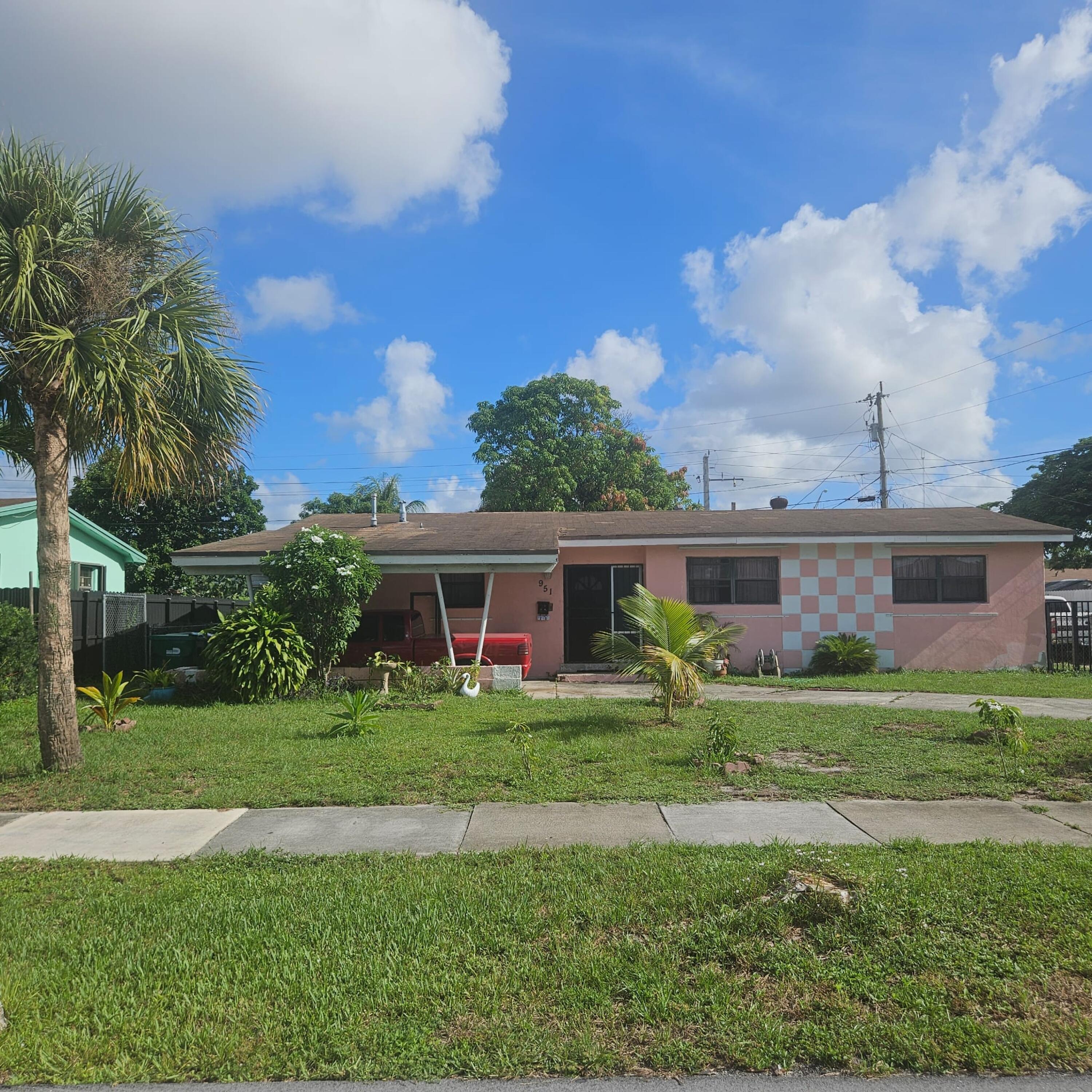 Beautiful SF 3/1 home with fenced yard with fruit trees. Driveway and carport front yard. Enclosed patio. Conveniently located.