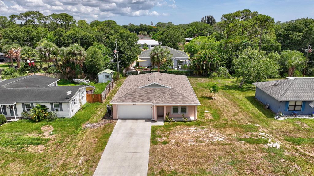 Photo of 7106 Lakeland Boulevard, Fort Pierce, FL 34951 (MLS # B26008472)