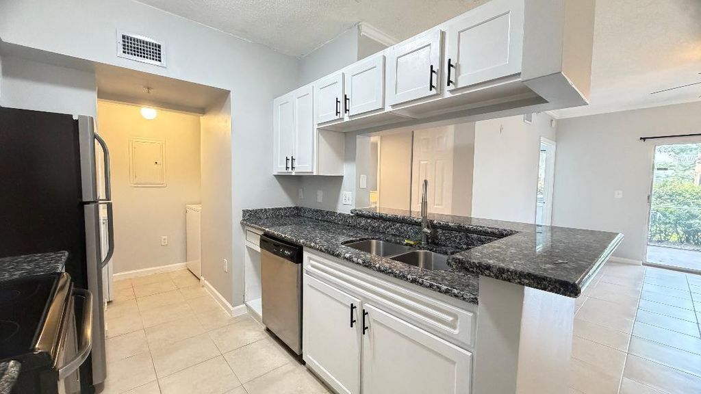 Photo of 11661 W Atlantic Boulevard, Coral Springs, FL 33071 (MLS # B26019640)