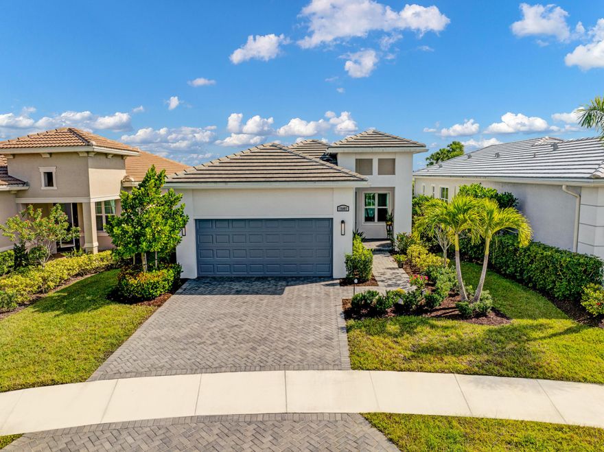 Enjoy lake views from your screened back patio on a quiet culs de sac! This pristine Bella model has both! Its lake front location on a peaceful street provides the perfect setting to spend relaxing evenings. This spacious home, with high ceilings and 8' doors, features 2 bedrooms plus a 3rd bedroom/flex room with french doors. The main living area is tiled throughout with a coffered ceiling in the living room. The eat in kitchen has wood cabinets, granite countertops, stainless appliances, and a snack bar counter. The master suite includes another coffer, 2 walk-in closets and a bath with dual sinks and floor to ceiling tiles in the shower. Windows are impact resistant with white cordless blinds. The garage floor is covered in industrial epoxy coating. The PGA Verano community has it all! There are an abundance of activities at the Club Talavera clubhouse with billiards, card rooms, a library, and various clubs and activities. There are 3 pools including a resort style pool, a resistance pool, and an indoor pool. There are also 3 fitness centers including a smartFIT training center and group fitness classes, plus a spa and wellness center. Outdoor activities include tennis, pickle ball, bocce, basketball, a tot playground, and optional golf membership. Shopping, restaurants, beautiful Florida beaches, and major highways are all nearby.