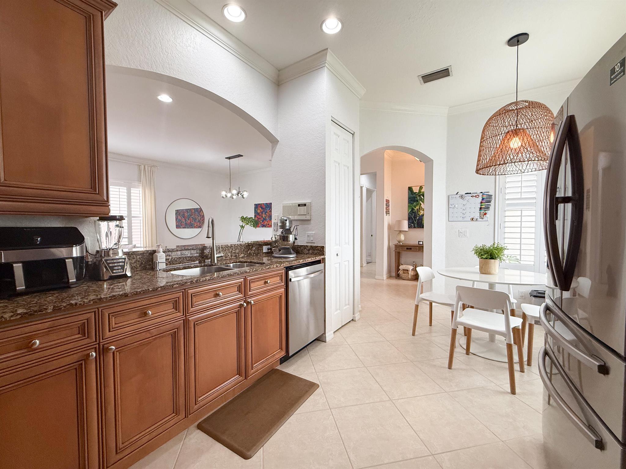 Beautiful single family home located in a highly sought-after community of Mirabella. This home offers an open and inviting layout with all tile and wood flooring, providing a clean and modern feel throughout. The kitchen is a chef's delight featuring newer appliances, granite countertops, plenty of cabinet space, and a functional design perfect for meal prep and entertaining. High speed internet & cable included in the rent. Mirabella is a 24 hour manned gated community with resort-style amenities such as the clubhouse, heated pool, spa, gym, yoga room, card room, separate kids clubhouse with playground & more that is all perfect for private parties & entertaining. Zoned for A-rated schools and conveniently located near beaches, dining, golf, and major highway