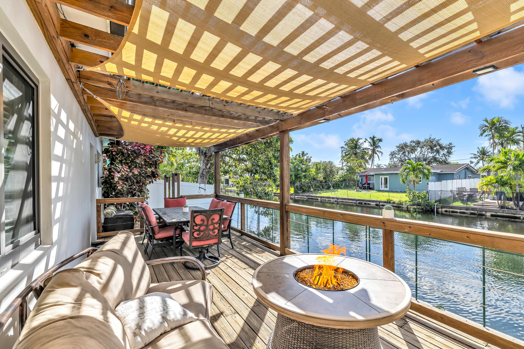 Minutes from Wilton Manors, the beaches, and downtown Oakland Park, this waterfront property offers the ideal balance of convenience and lifestyle.With over 2,100 square feet of thoughtfully designed living space, the home is perfect for both comfortable living and sophisticated entertaining. Features include a sleek metal roof, impact windows and doors, and a spacious two-car garage. The open floor plan flows seamlessly to a custom deck and pergola, creating the perfect setting for weekend gatherings or quiet evenings outdoors.With no HOA restrictions, owners can enjoy true independence and flexibility.