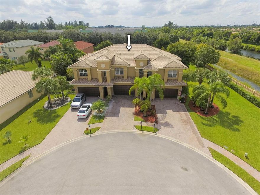 Spacious townhouse located on a cul-de-sac. Tiled downstairs living area with high ceilings and recessed lighting, laundry room, and double sliders to patio from living and dining area.  Wood floors upstairs with master suite and loft. Open covered patio with large grassy area and no neighbors behind you. Ample parking with 2 car garage and paver driveway. One of only 6 townhomes in community. Bella Terra is a gated community with pool and spa, and basketball and tennis courts.