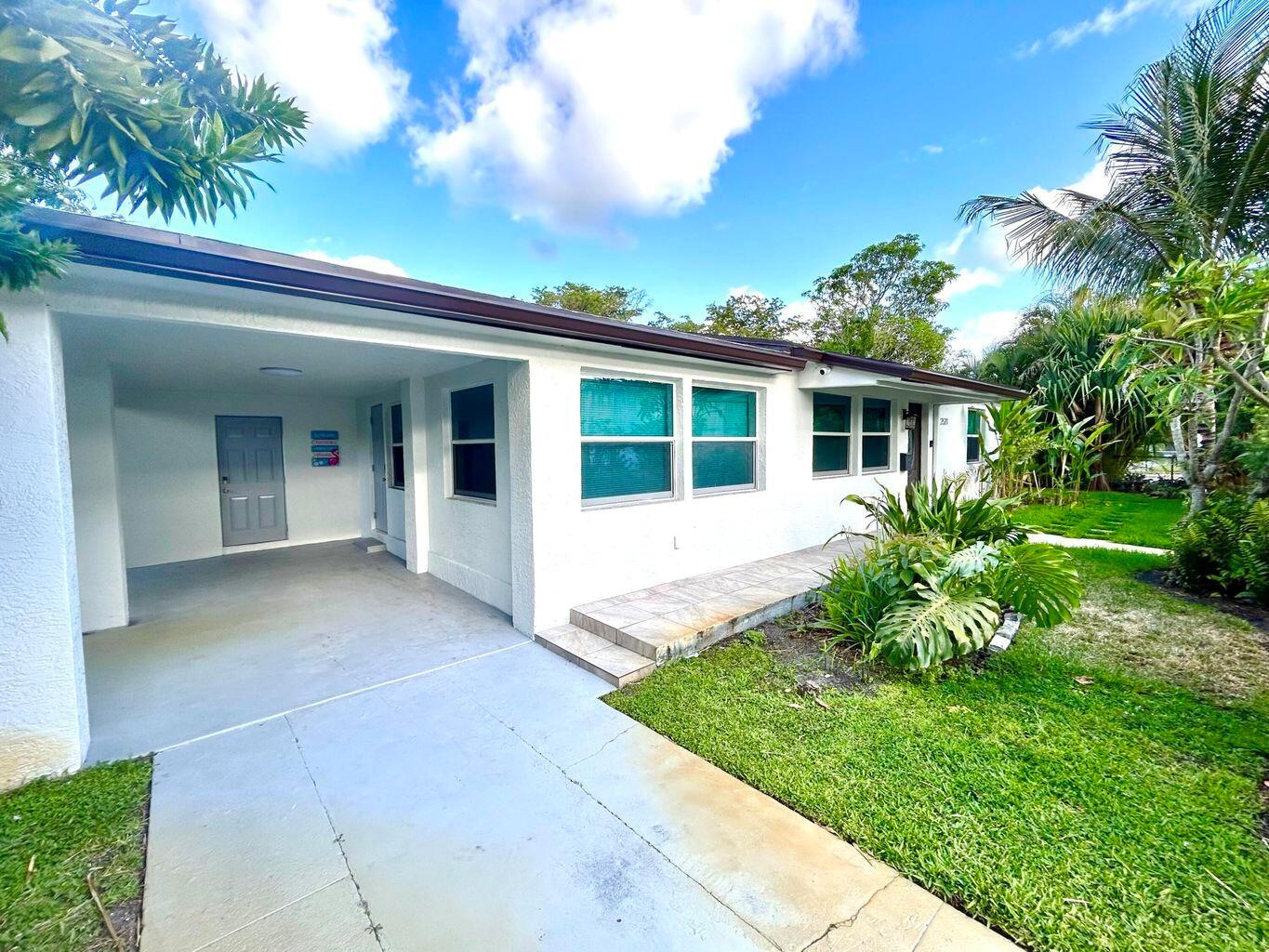 No HOA and an easy application process! Water, lawn care, electric and pest control included! Located just a mile from downtown West Palm Beach and PBI Airport, this beautifully updated home offers an excellent location near shops, restaurants, and activities. Situated on a private corner lot with a gated perimeter and carport. The home also features a private laundry room. Inside, enjoy a cozy family room with smart TV, dining area, and open kitchen. The spacious primary suite includes a luxurious bathroom. Two additional bedrooms and a second full bath complete the home. Close to CityPlace, beaches, Palm Beach Zoo, Drive Shack, Norton Museum, Clematis by night, and major highways are all within 5 minutes.