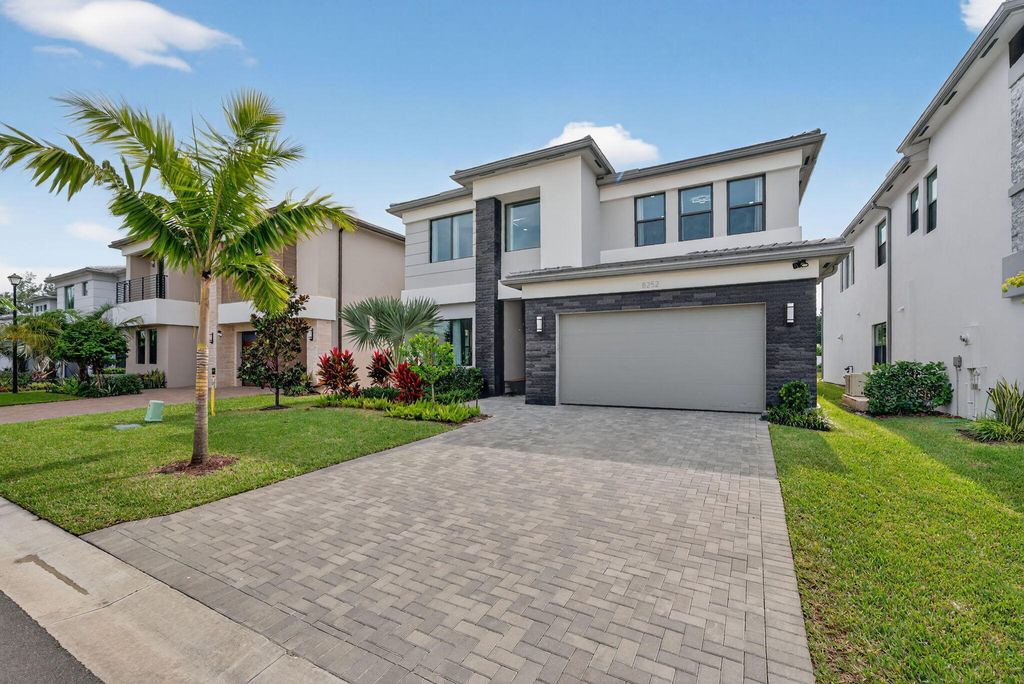 Photo of 8252 Essex Country Club Drive, Boca Raton, FL 33434 (MLS # B26032091)