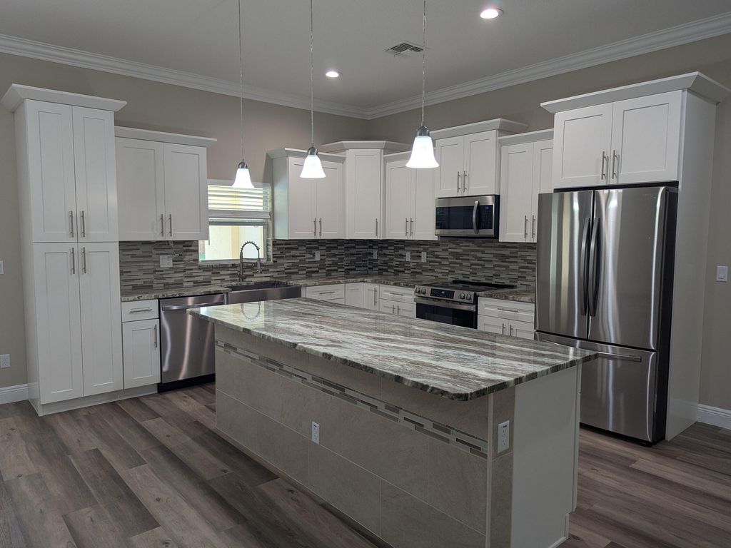 Photo of 2852 SW Collings Drive, Port Saint Lucie, FL 34953 (MLS # B26026368)