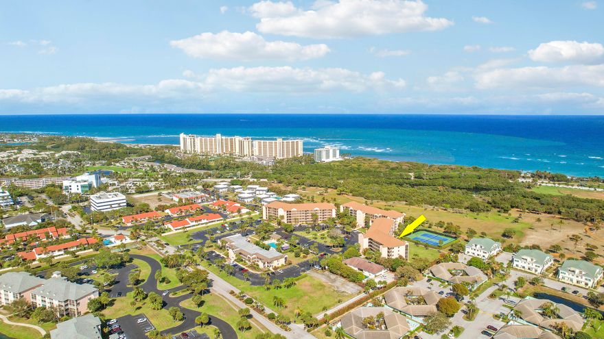 Enjoy panoramic views over the park and Heart Trail, with the beach just a short stroll away. This beautifully furnished 1BR/1.5BA condo on the 4th floor sits high enough to capture distant views of the ocean on clear, sunny days. Newly installed luxury vinyl plank flooring adds a fresh, updated feel throughout. The condo also features a renovated kitchen and updated baths. Located in the sought-after Jupiter Bay community, it's a wonderful place to relax and enjoy the coastal lifestyle. The community offers a pool and tennis courts. A full-service restaurant is nearby, along with easy access to the beach, restaurants, and shopping. Offered fully turnkey furnished for comfort and convenience. Come enjoy the Jupiter beach lifestyle.