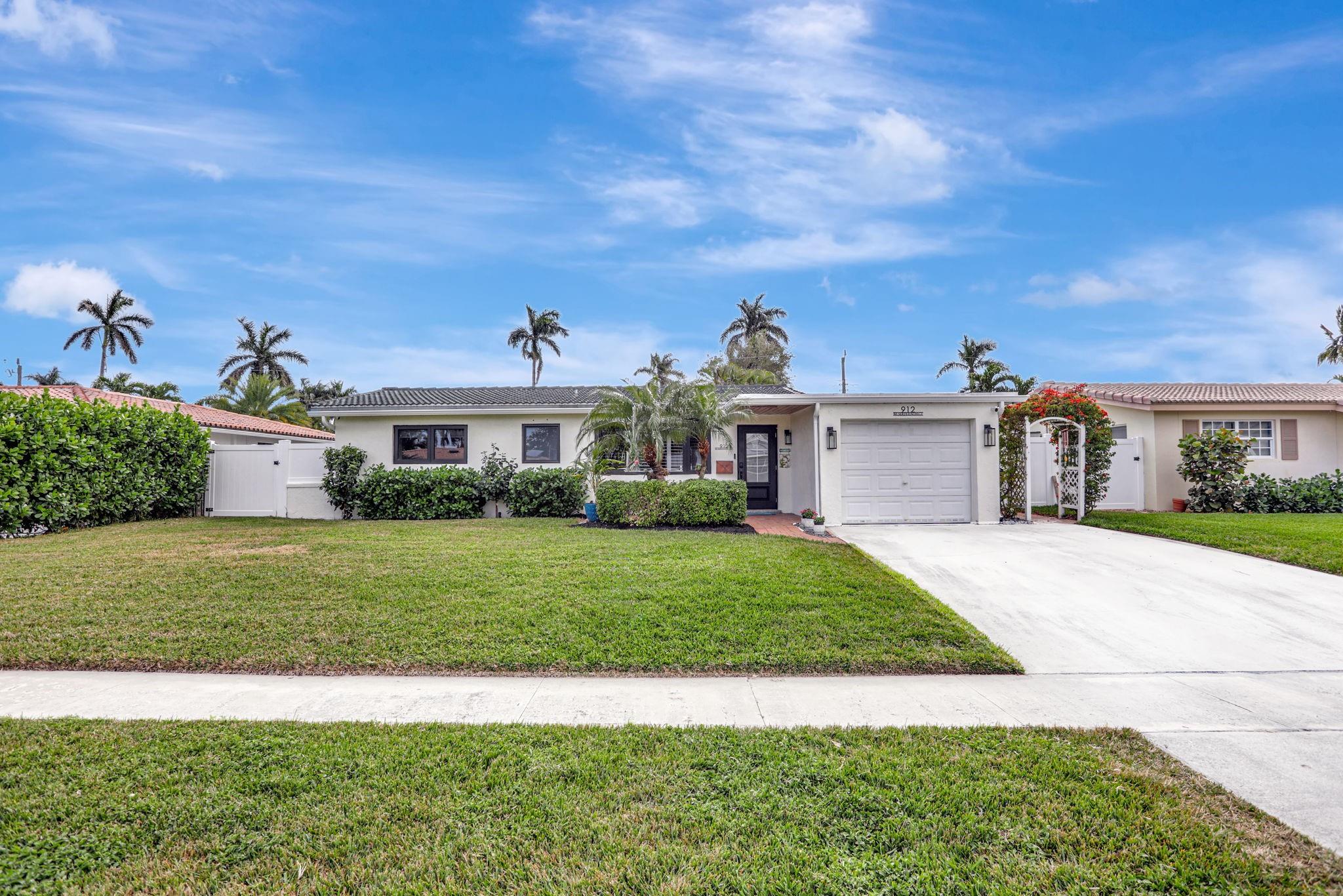Don’t miss this fully renovated, highly sought-after 3BR/3BA home with a spacious open floor plan and abundant natural light. Features include a remodeled kitchen with granite countertops, white cabinetry, and brand-new stainless steel appliances. Large dining and living areas perfect for entertaining. Hurricane-impact windows and doors with plantation shutters throughout for style and peace of mind. Private primary suite offers French doors, a sitting area, office space, and a newly designed custom bathroom. Additional highlights include a large fenced yard, new attic insulation, updated ductwork, and PVC plumbing. Prime location near the beach, Intracoastal, The Cove, shopping, and dining. Enjoy the best of coastal living in award-winning Deerfield Beach!