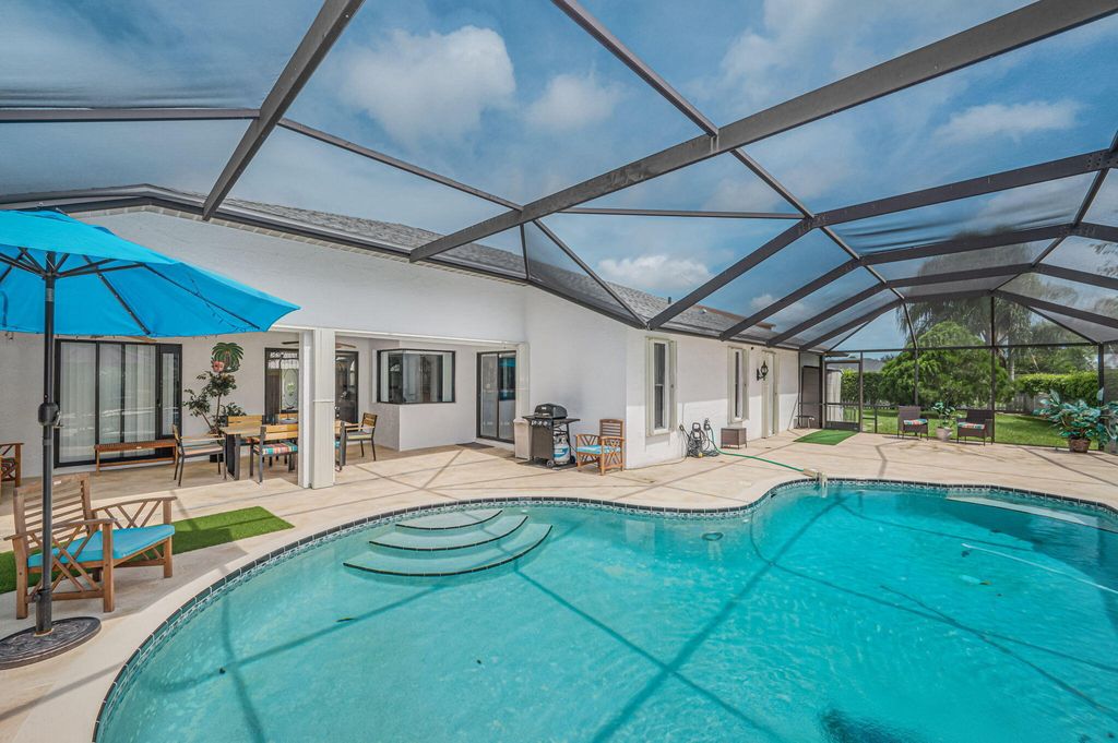 Photo of 6410 NW Zee Court, Port Saint Lucie, FL 34986 (MLS # B26003601)