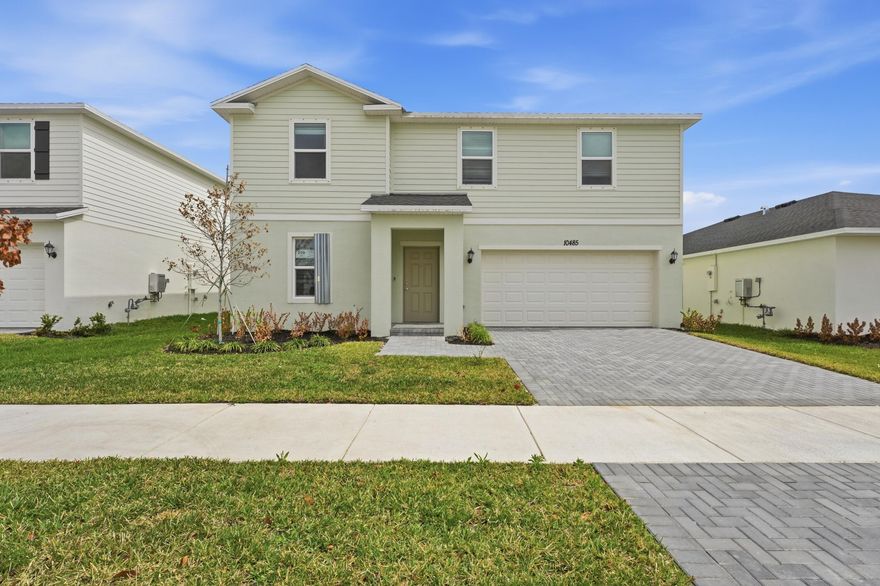 The first floor of this two-story home shares an open layout between the kitchen, dining area and family room with access to the patio. A secondary bedroom on the first floor can easily be converted to a guest room or home office. Upstairs is a versatile loft that serves as an additional shared living space, along with three secondary bedrooms and a luxe owner's suite comprised of an en-suite bathroom and a large walk-in closet.