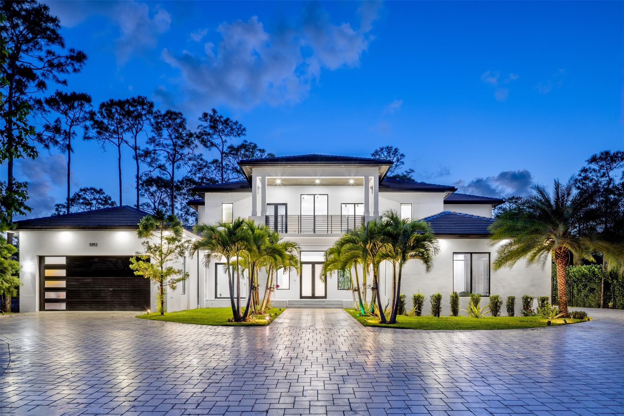 Experience refined living in this meticulously crafted, gated luxury estate, in the heart of Parkland. Nestled amid mature trees & lush greenery, this modern masterpiece offers the perfect blend of elegance, comfort, and contemporary design. Boasting 6BD/5.5BA across 7400+SF of open-concept living, this home is filled with upscale finishes — from soaring ceilings & oversized windows, to imported porcelain flooring and designer lighting. The gourmet kitchen features custom cabinetry, quartzite countertops, a sprawling island, & premium appliances. Located within top-rated schools, walking trails, and nearby parks, this home offers both tranquility and convenience. Parkland is known for its family-friendly lifestyle, equestrian roots, proximity to first rate schools, fine dining & shopping.