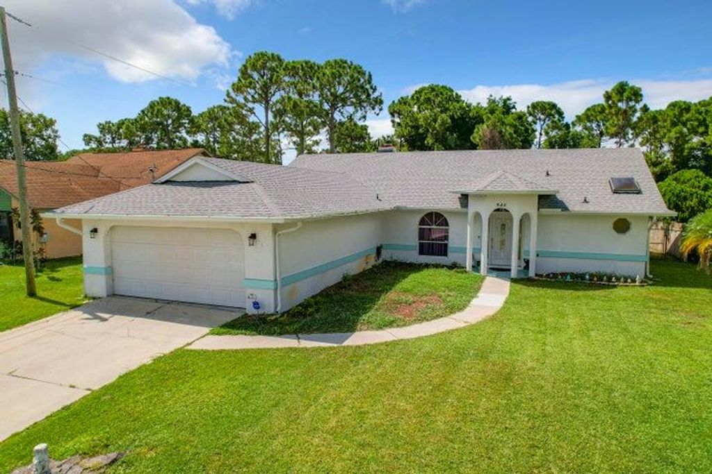 Photo of 622 SE Portage Avenue, Port Saint Lucie, FL 34984 (MLS # R10937788)