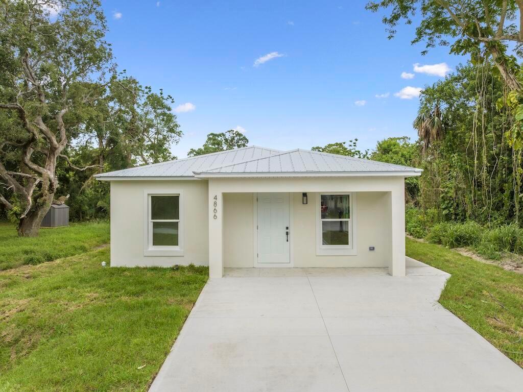 Don't miss this brand-new 2025-built 2/2 home. Features metal roof, CBS construction, smooth stucco, impact windows and doors, LED lighting, stainless appliances, quartz countertops, plywood shaker cabinets, walk-in closets, and a large driveway. Modern design in a great location with ample yard space.