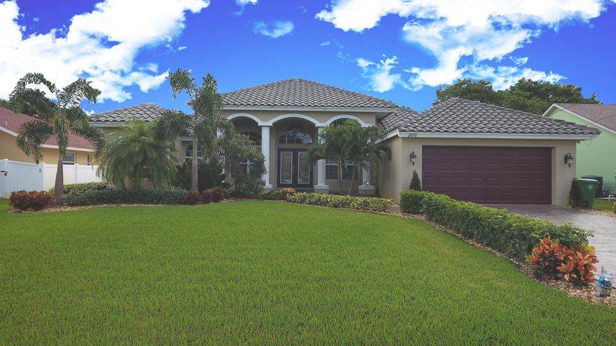 Immaculate ~ 4 BEDROOM POOL HOME Built in 2005 CBS construction...With over 2493 square feet under air...This home has Everything... Crown Molding... Roomy Kitchen with Stainless Steel Appliances with Corian Counter tops  ...FENCED YARD,SCREEN LANAI with TILE, LARGE MASTER SUIT DOUBLE VANITY SINKS...PLANTATION SHUTTERS Lush landscaping amazing pool area with TIKI HUT with a SUMMER KITCHEN great for entertaining...Move in ready needs nothing ..Fantastic  Quiet Neighborhood,Great Location Minutes to turnpike and 95 close to all major shopping...Beaches only minutes away (home is priced to sell)